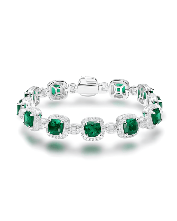 The Gem Vivi Emerald Candy Cube Cushion Bracelet features square-cut green gemstones in sterling silver links with a box clasp—an elegant accessory that adds sophistication to any look.