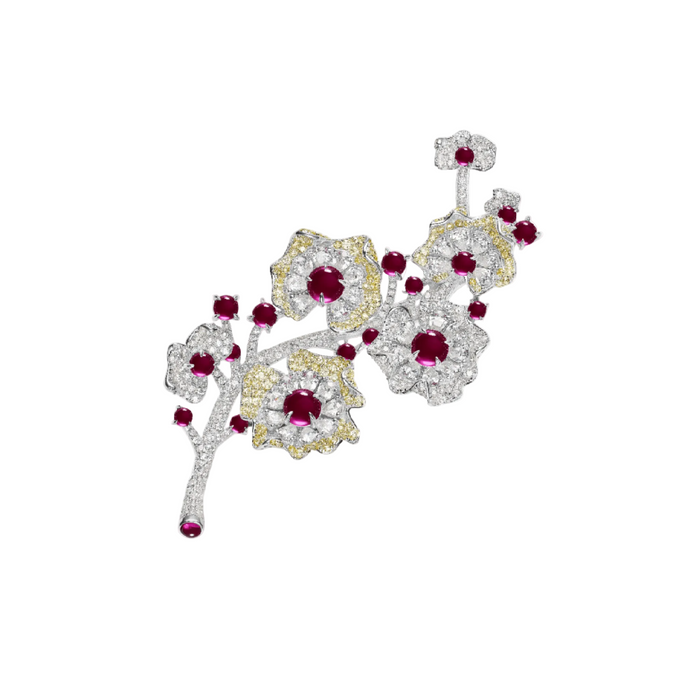 The Plum Blossom Harmony Brooch by Gem Vivi features red gemstones and white and yellow encrusted petals in a floral branch design—an elegant accessory that sparkles beautifully on any occasion.