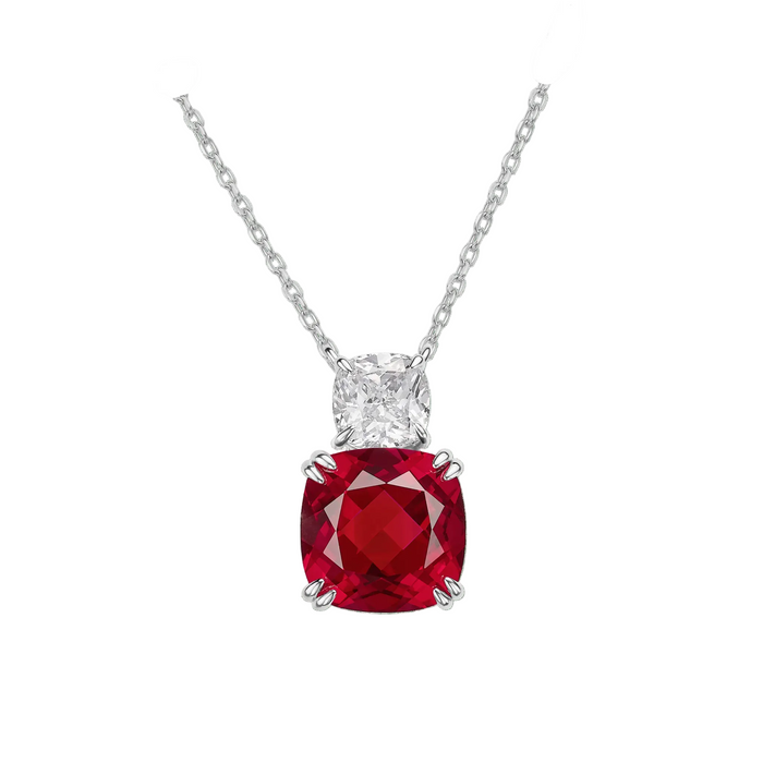 The Red Ruby Duo Pendant Necklace by Gem Vivi features a lab-created cushion-cut red ruby pendant with a smaller clear gem above, all set in 18k white gold on a delicate chain.