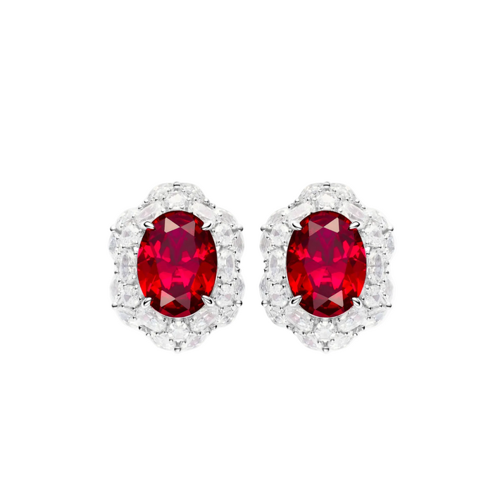 The Celina Scarlet Oval Stud Earrings by Gem Vivi feature lab-created rubies in 18k white gold, accented with a halo of sparkling clear stones for brilliant shine.