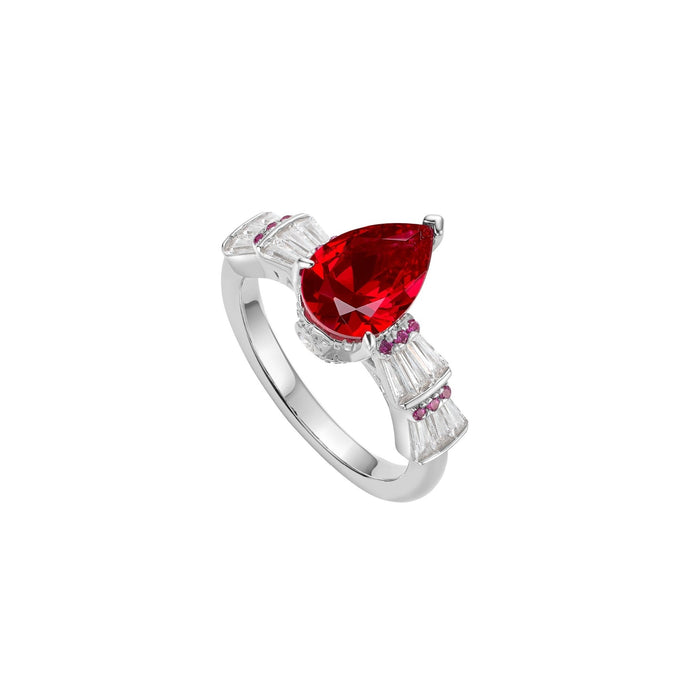 The Gem Vivi Baguette And Teardrop Ruby Ring showcases a large lab-created pear-cut ruby in 18k white gold, accented by small white and pink stones on each side.