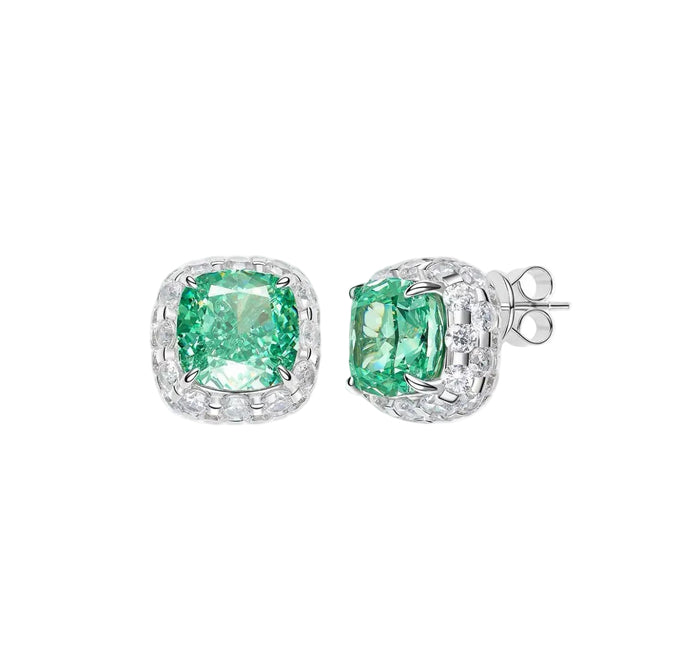 The Gem Vivi Glow Paraiba Stud Earrings are crafted in 18k white gold, featuring cushion-cut green stones encircled by sparkling clear halos.