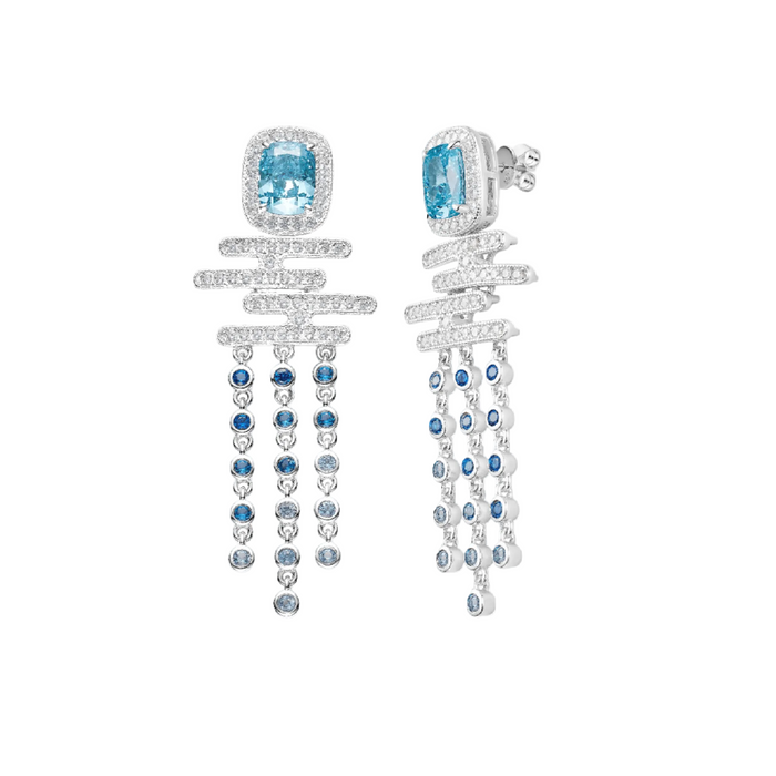 The Cadence Cascade Earrings by Gem Vivi are sculptural silver pieces with square blue aquamarine cubic zirconia, horizontal diamond-set bars, and dangling strands accented by blue and clear stones.