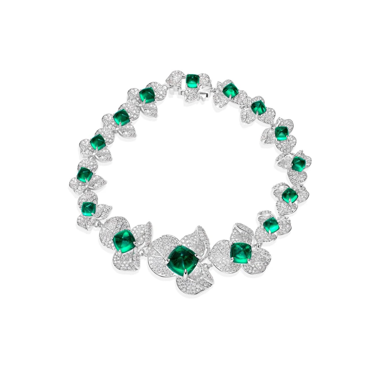 The Emerald Blossom Couture Bracelet by Gem Vivi features green cushion-cut emeralds and leaf-shaped diamond settings, creating a captivating floral motif design.