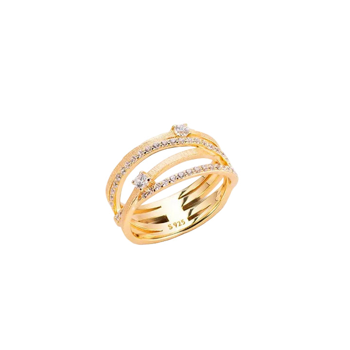 The Gem Vivi Sparkle Celeste Crossing Band features three gold-tone parallel bands, two lined with cubic zirconia and two larger stones set on top. Inside is marked "S 925.