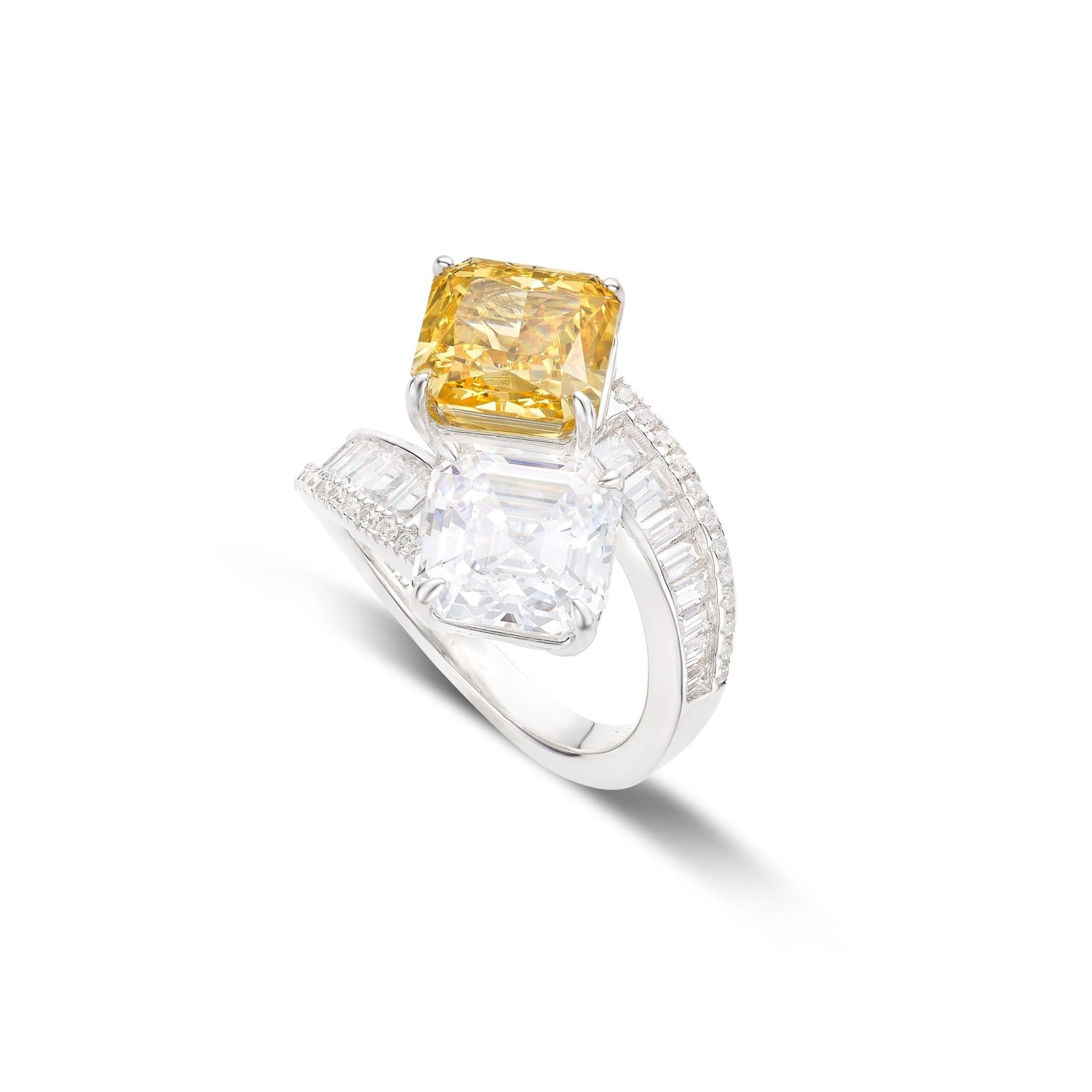 The Gem Vivi Citrine Twist Ring features 18k white gold, a vibrant canary yellow citrine gemstone, a clear square-cut accent stone, and a band adorned with rows of sparkling white diamonds.