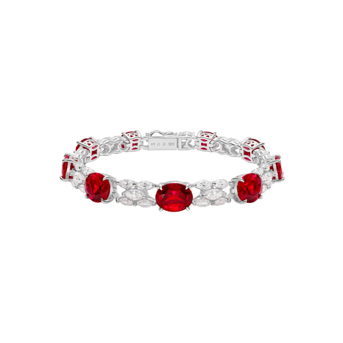 The Gem Vivi Celeste Scarlet Ruby Statement Bracelet features large oval lab-created rubies and clear marquise-cut stones in an alternating design.
