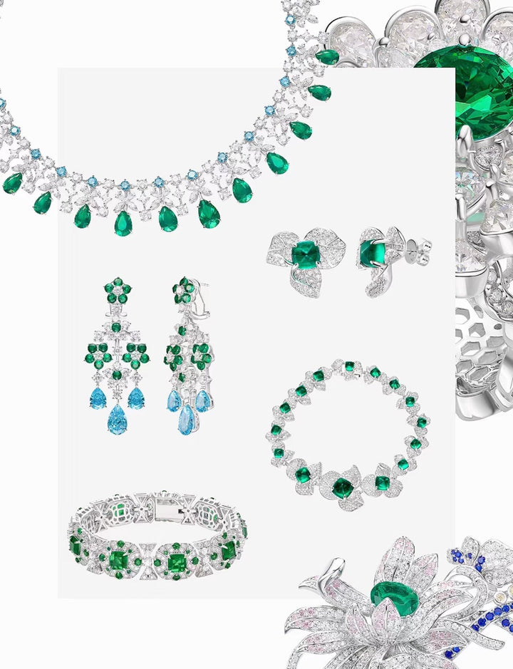 Gem Vivi's Emerald Cascade Harmony Drop Earrings, crafted in 18k white gold with emeralds and diamonds, are beautifully displayed on a white background.