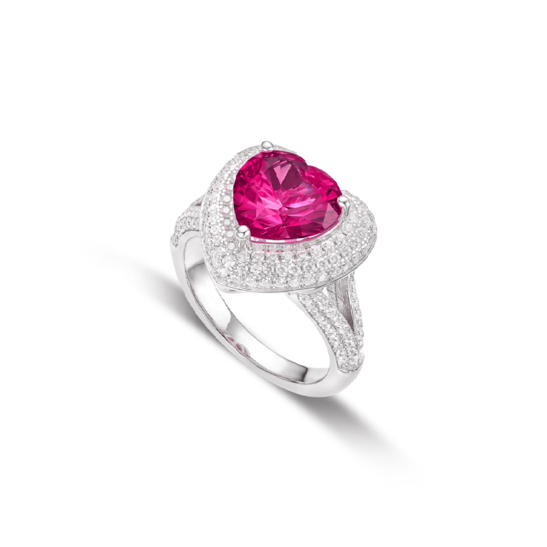 The Gem Vivi Fuchsia Flame Pink Heart Ring features a large heart-shaped fuchsia gemstone with sparkling cubic zirconia accents in a silver setting, displayed against a white background.