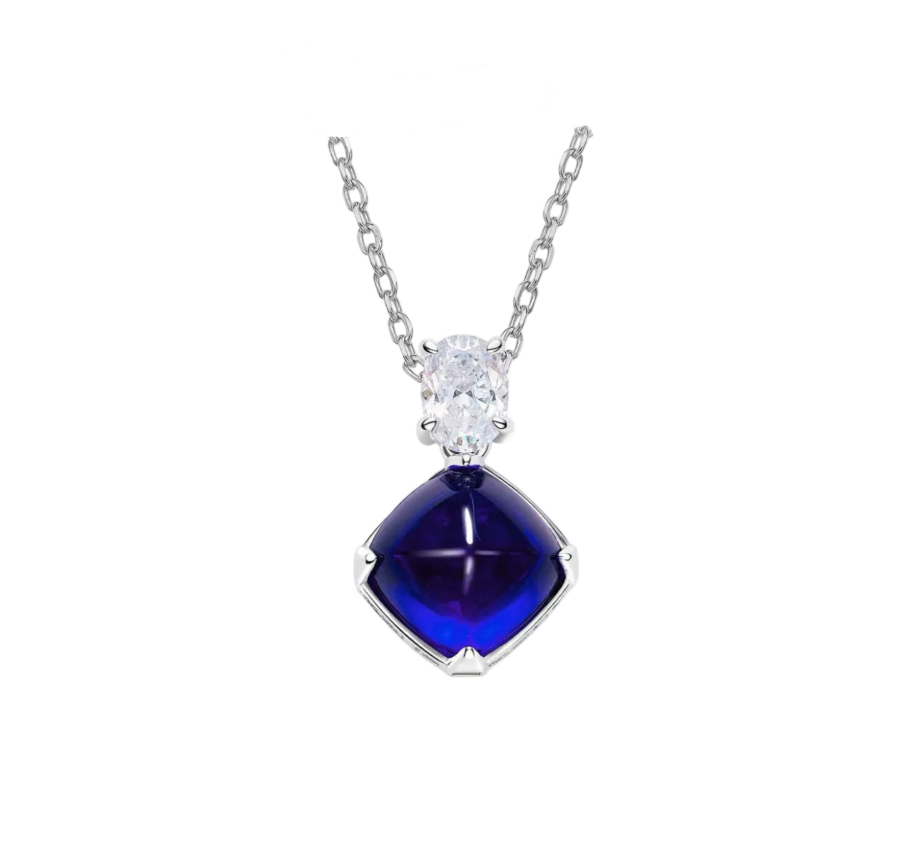 The Gem Vivi Blue Midnight Sugar-Loaf Pendant Necklace features a deep blue sugar-loaf gemstone and an oval cubic zirconia set in silver, displayed against a white background.