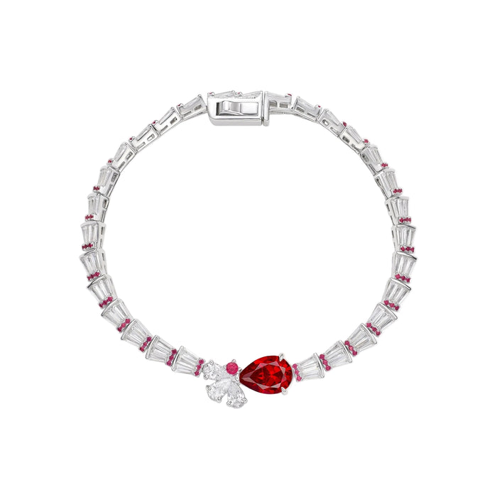 The Gem Vivi Baguette And Pear Ruby Link Bracelet showcases alternating rectangular clear stones and small red gems, highlighted by a teardrop-shaped red gemstone and two clear stones at the center.