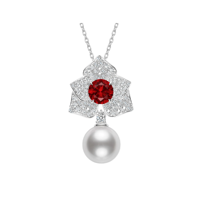 The Cascade Pearl Rosette Ruby Necklace from Gem Vivi features a diamond-studded flower with a red ruby center and a large white pearl drop.