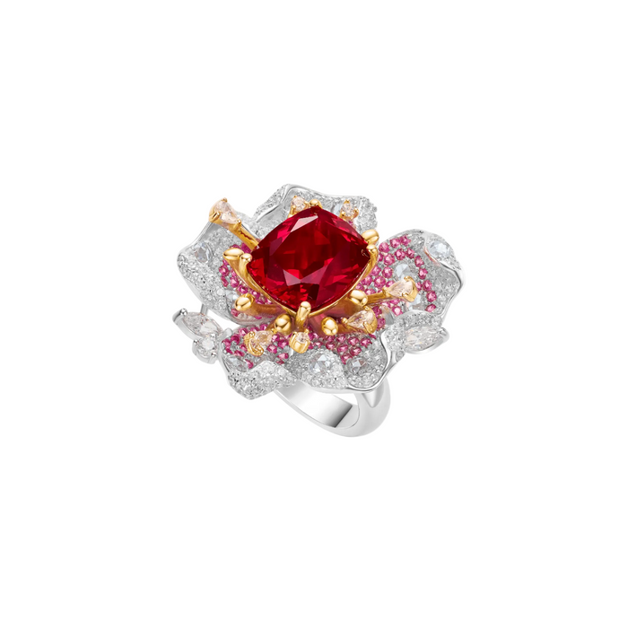 The Cherish Floral Ring by Gem Vivi features a cushion-cut red ruby center, gold and silver floral accents with pink and white stones, all set in 18k white gold.