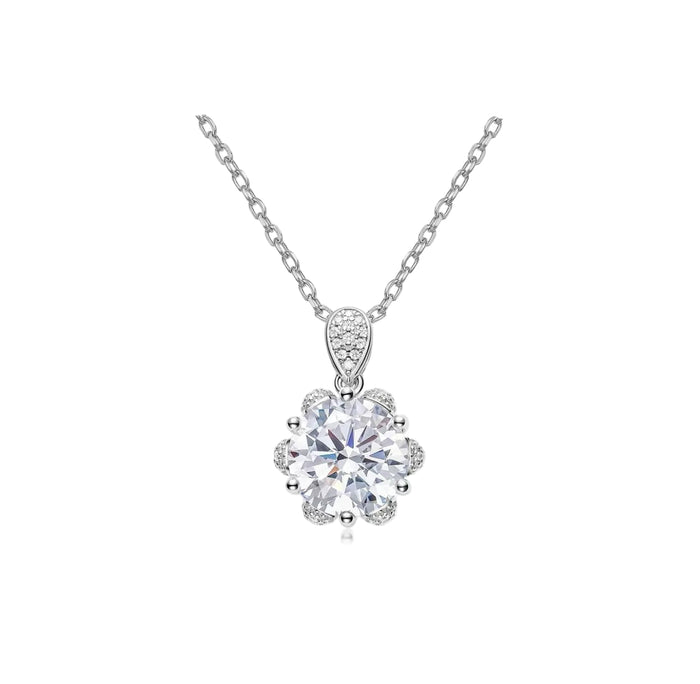 The Gem Vivi Celestia Bloom Solitaire Necklace features a thin chain and a flower-shaped pendant with a central gemstone and smaller stones, all crafted in 18k white gold for an elegant DiamondLuxe look.