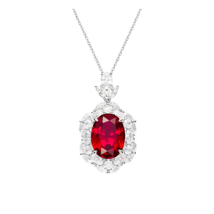The Gem Vivi Celina Scarlet Ruby Pendant Necklace showcases an oval lab-created ruby pendant, encircled by round and marquise-cut stones, all set in sterling silver on a delicate chain.