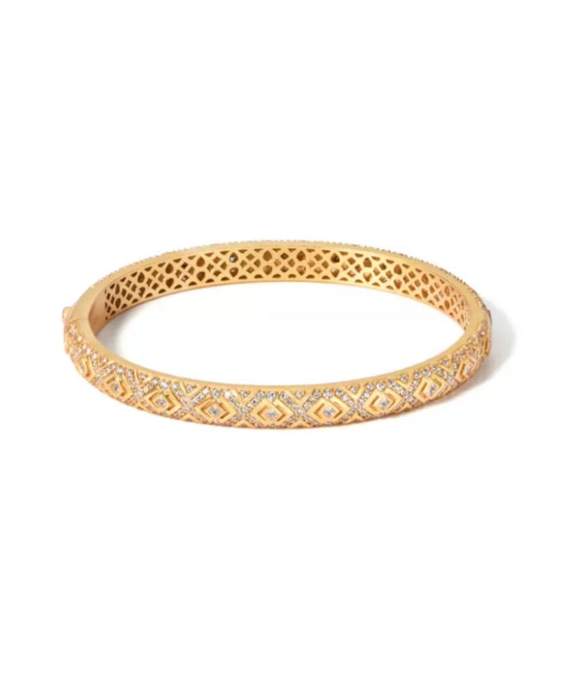 The Selena Lattice Bangle by Gem Vivi features an intricate geometric pattern in 18K yellow gold with sparkling diamond accents, shown on a white background.