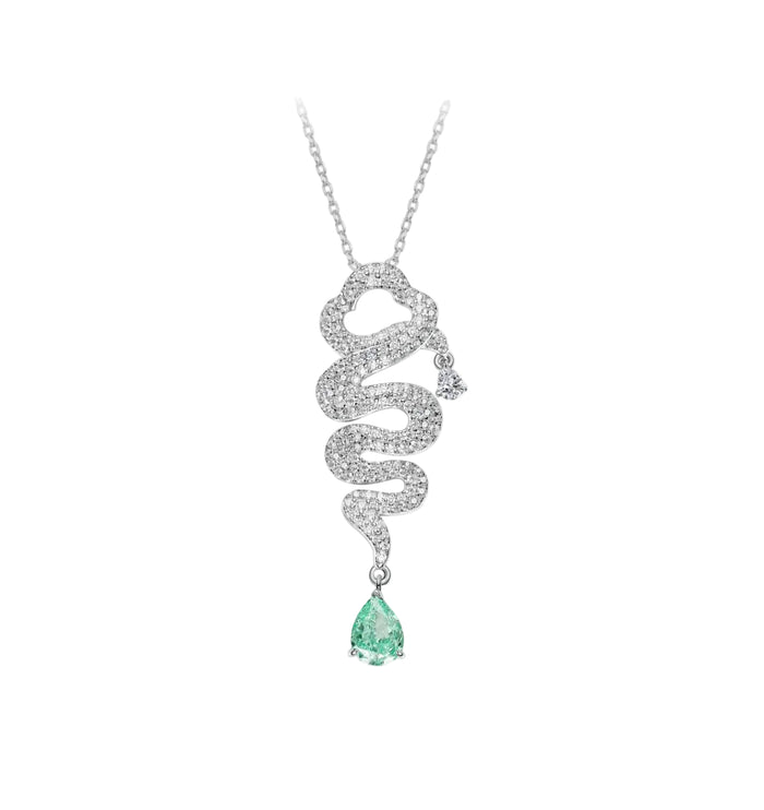 The Gem Vivi Serpentine Paraiba Drop Necklace features an 18k white gold snake-inspired design with a pear-shaped green gemstone pendant, shown on a white background.