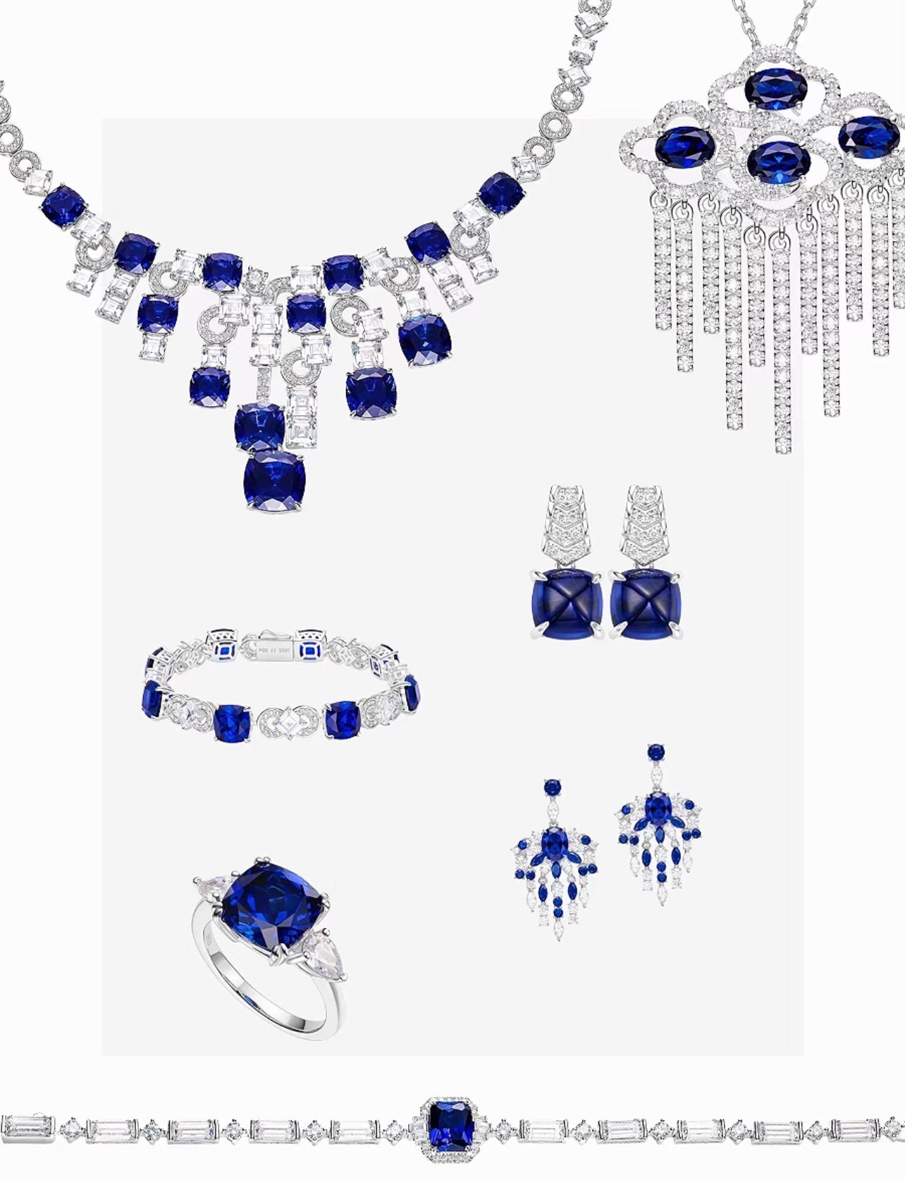 The Gem Vivi Blue Sapphire Trilogy Ring, a stunning silver piece with lab-created blue sapphires, is beautifully displayed on a white background.